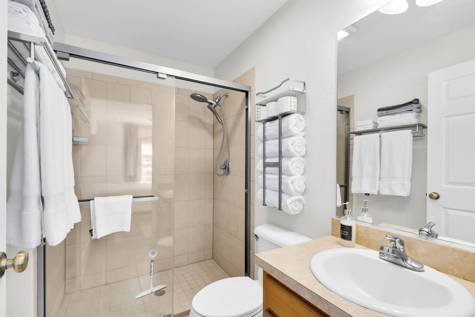 Bathroom with walk-in shower and towels