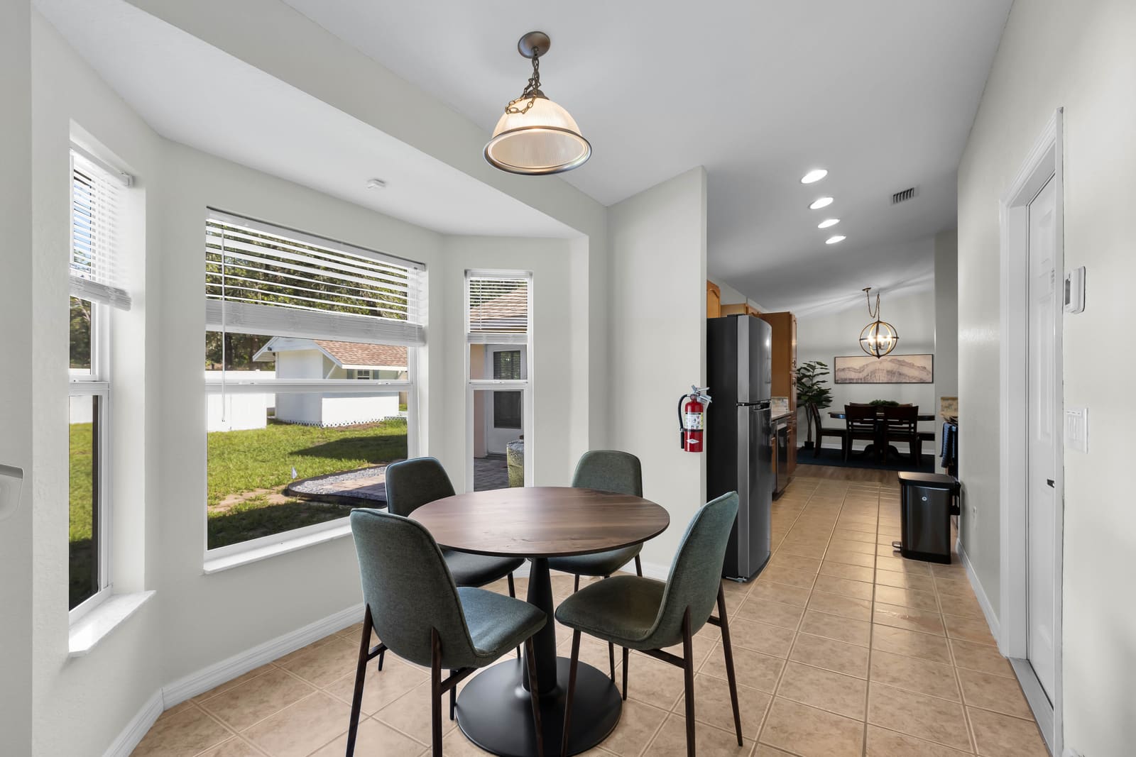 Breakfast nook with bay window looking onto the yard